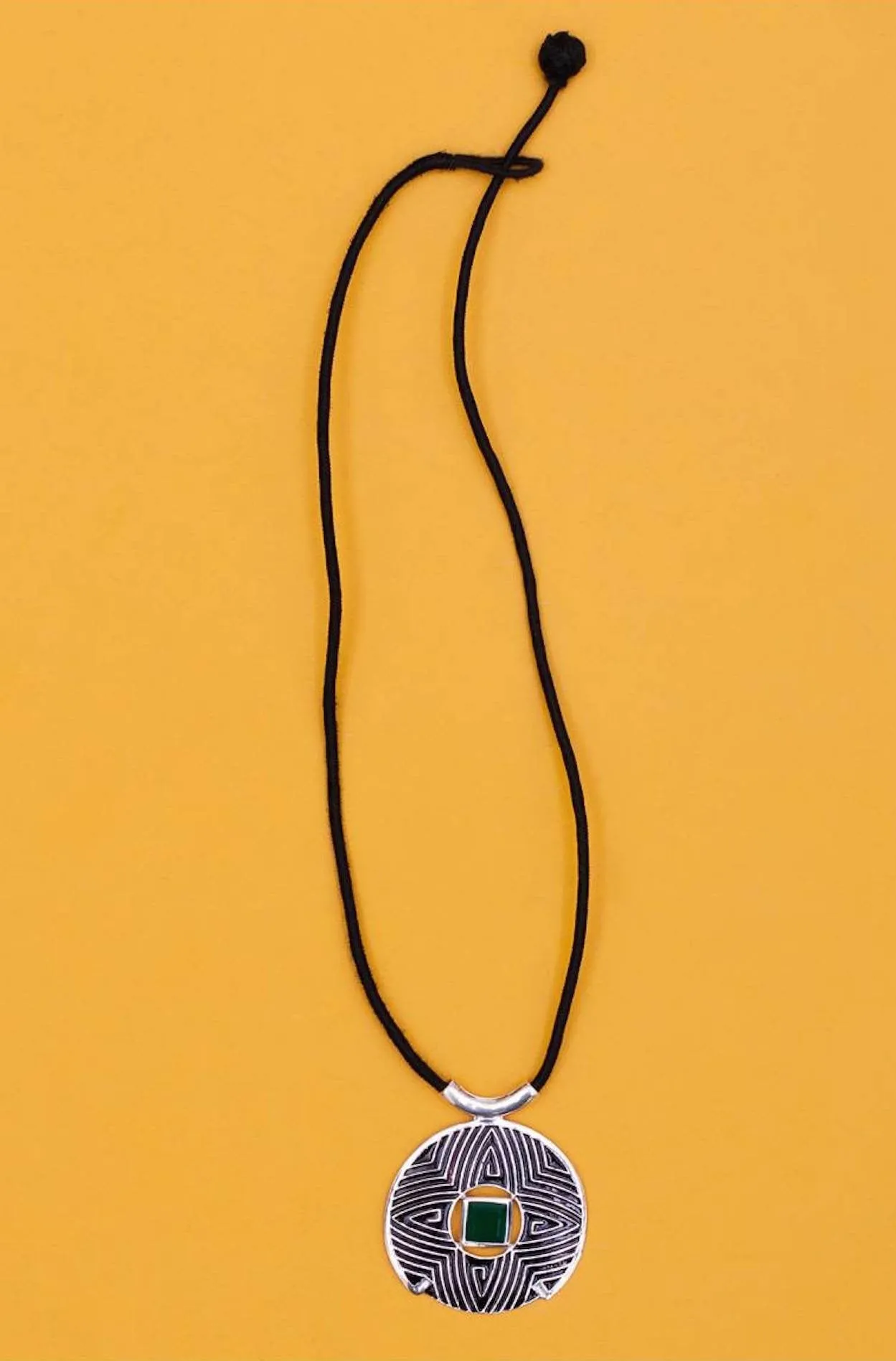 Gorgeous, large round pendant with fine black enamel work and a faceted chrysoprase