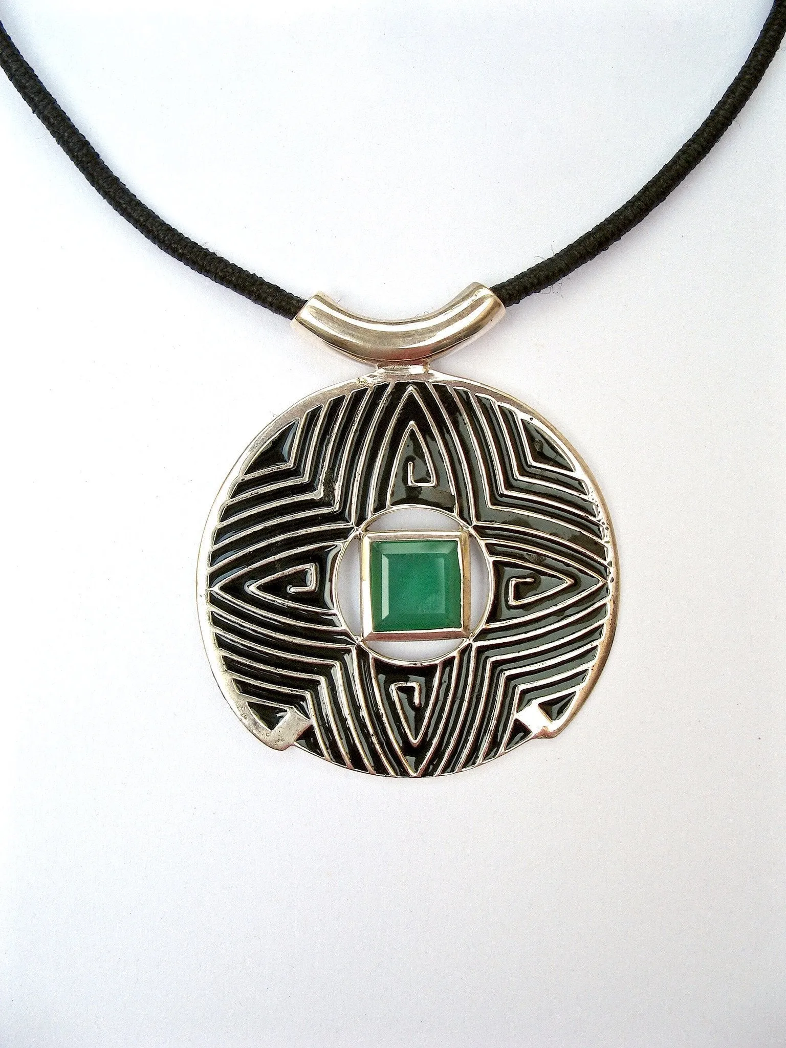 Gorgeous, large round pendant with fine black enamel work and a faceted chrysoprase