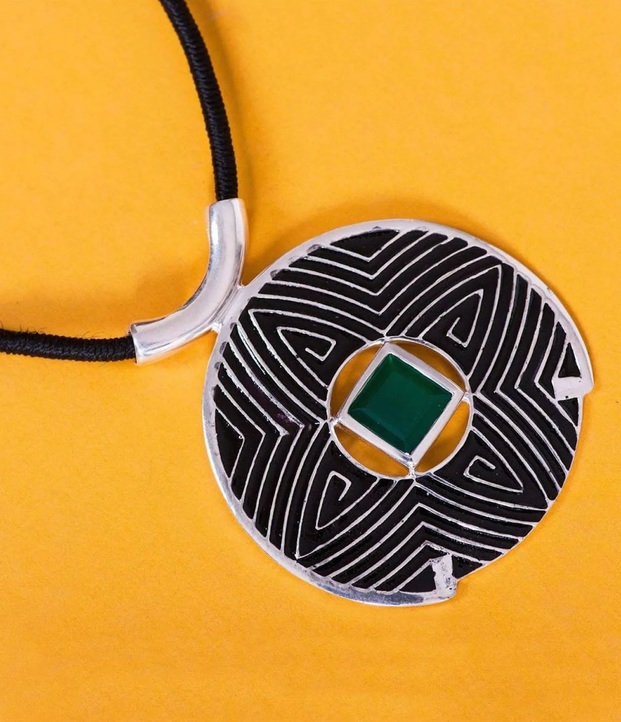 Gorgeous, large round pendant with fine black enamel work and a faceted chrysoprase