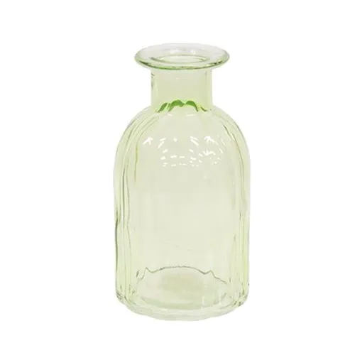 Small beveled green glass bottle vase