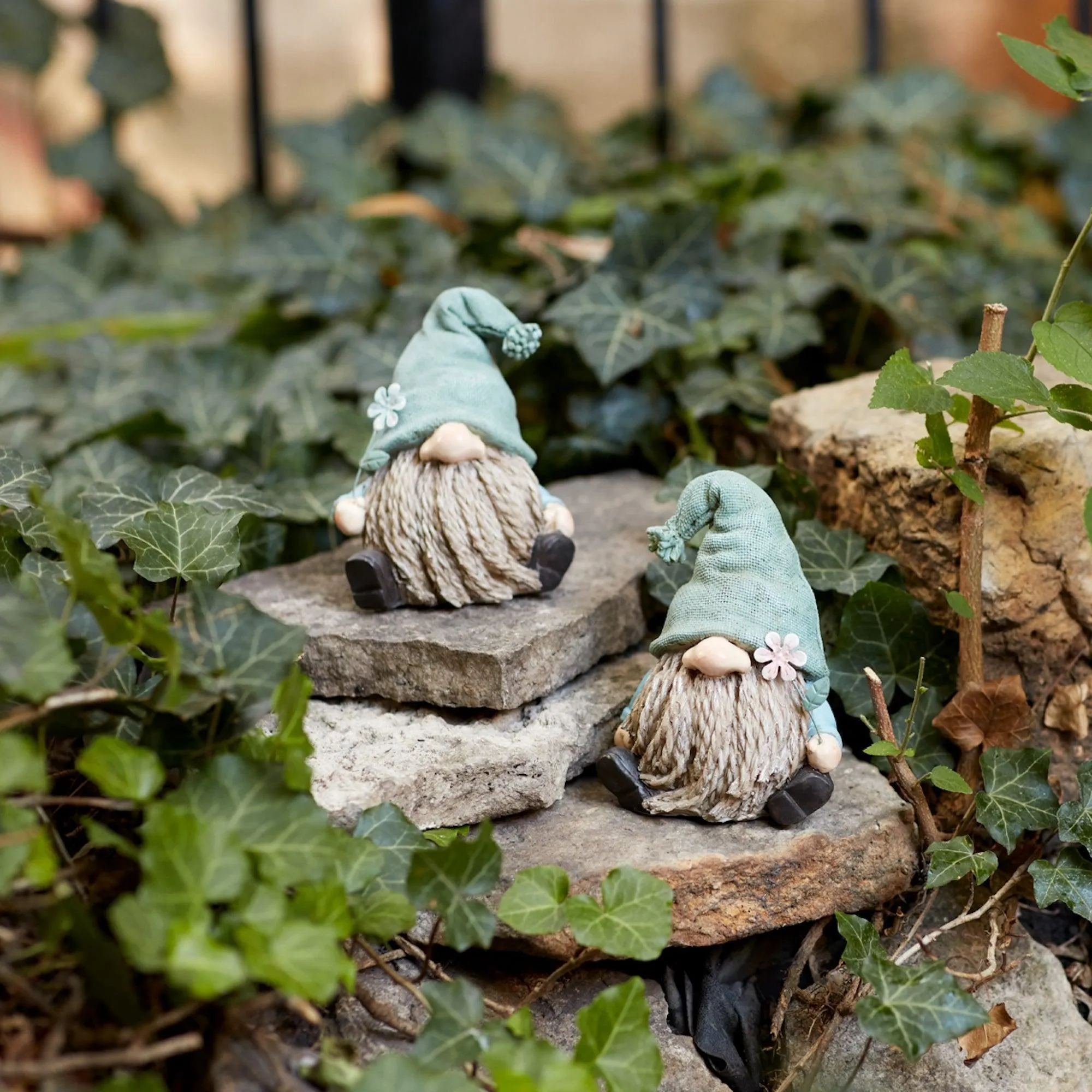 Stone Garden Gnome Figurine with Flower Stem Accent (Set of 4)