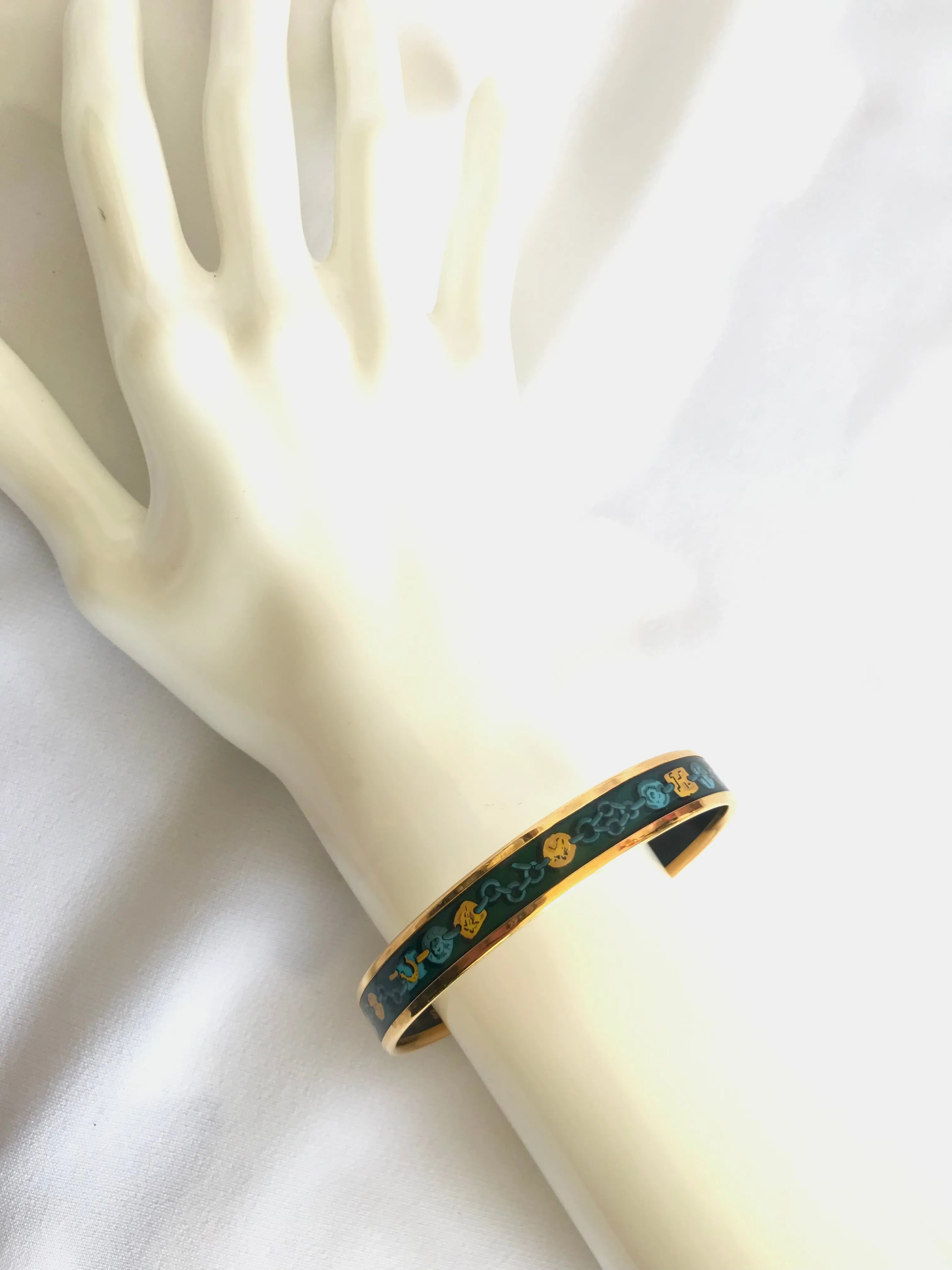 Ves. Vintage Hermes cloisonne enamel bangle with green, yellow, and blue. Charm and chain design. 050320r7