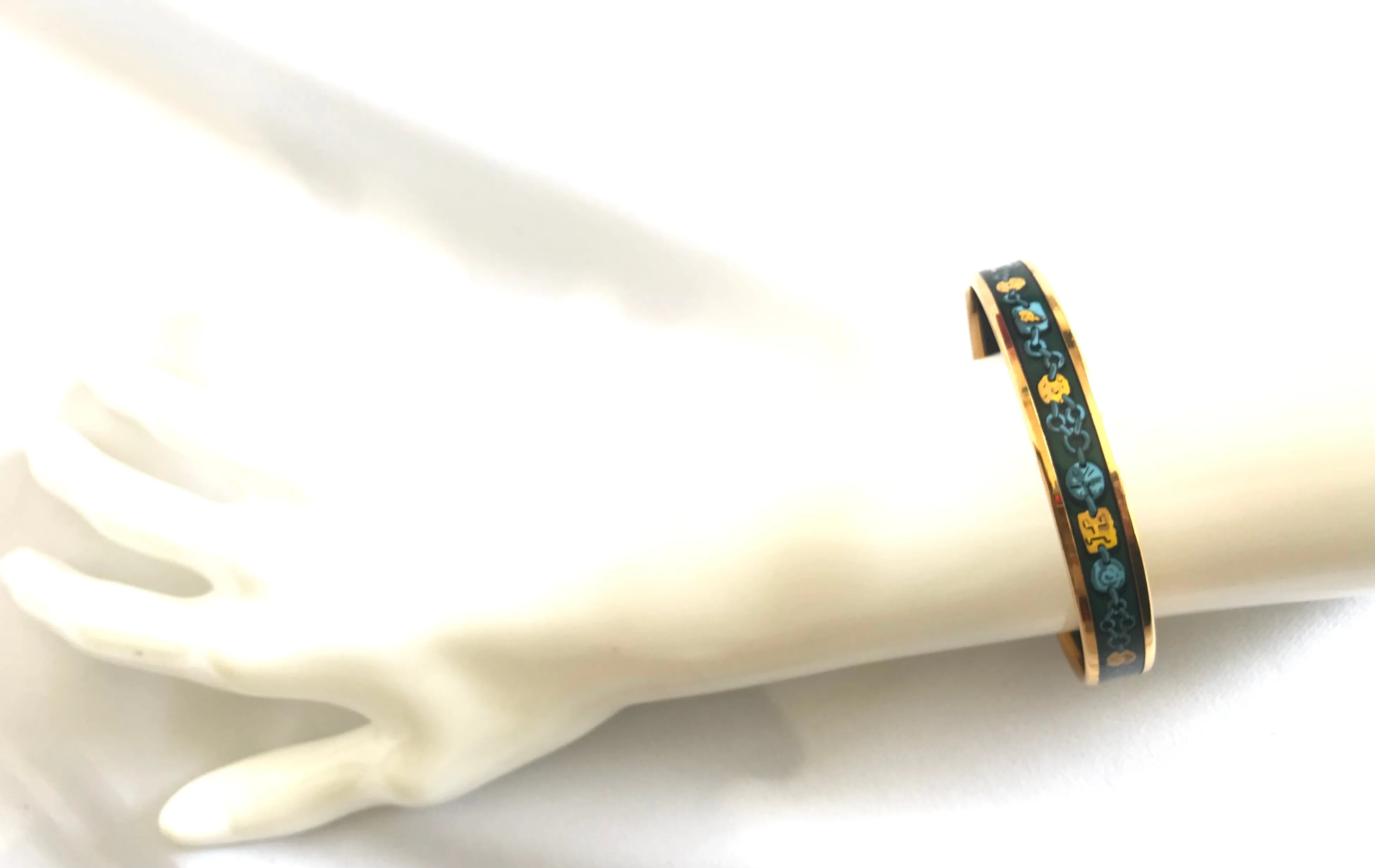 Ves. Vintage Hermes cloisonne enamel bangle with green, yellow, and blue. Charm and chain design. 050320r7